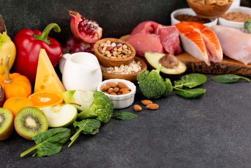 Whole foods meal with fresh fruits, vegetables, grains, and lean protein