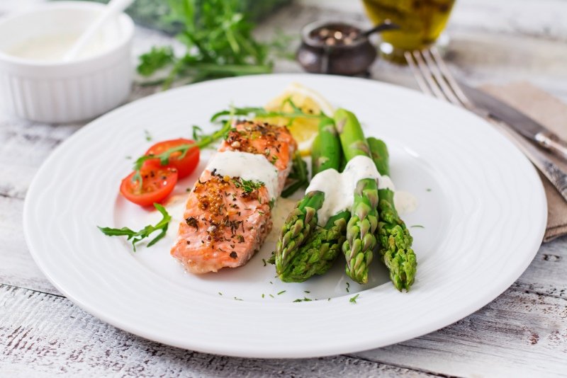Heart healthy Mediterranean diet meal plan USA with salmon, leafy greens, olive oil and whole grains
