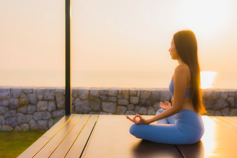 Person practicing Best Meditation for Stress and Anxiety USA during peaceful morning routine