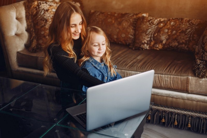 UK mother applying work life balance tips UK moms recommend by closing laptop after work hours