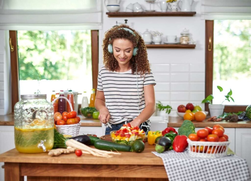 A clean UK kitchen filled with fresh organic vegetables and single-ingredient whole foods.